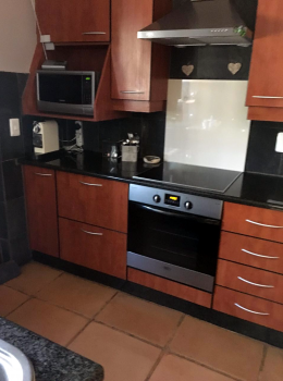 Original Melamine Cherry wood cabinets.