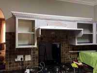 Installing Cornicing.